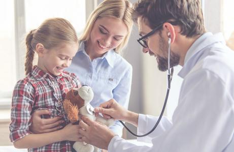 Doctor examining child's stuffed dog